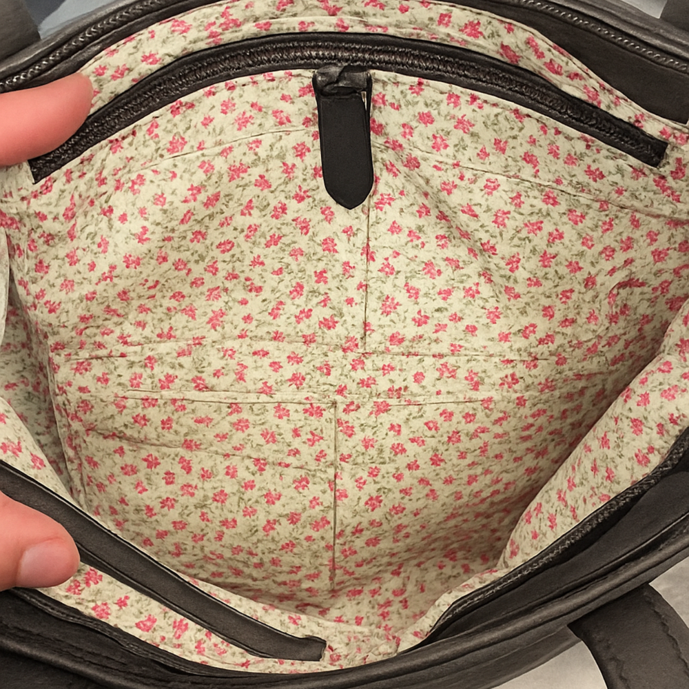Floral-patterned fabric inside a bag with a zipper