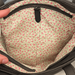 Floral-patterned fabric inside a bag with a zipper