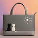 Gray handbag with cat designs on a gradient background