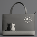 Gray handbag with black and white cat design and heart patterns on a gray background