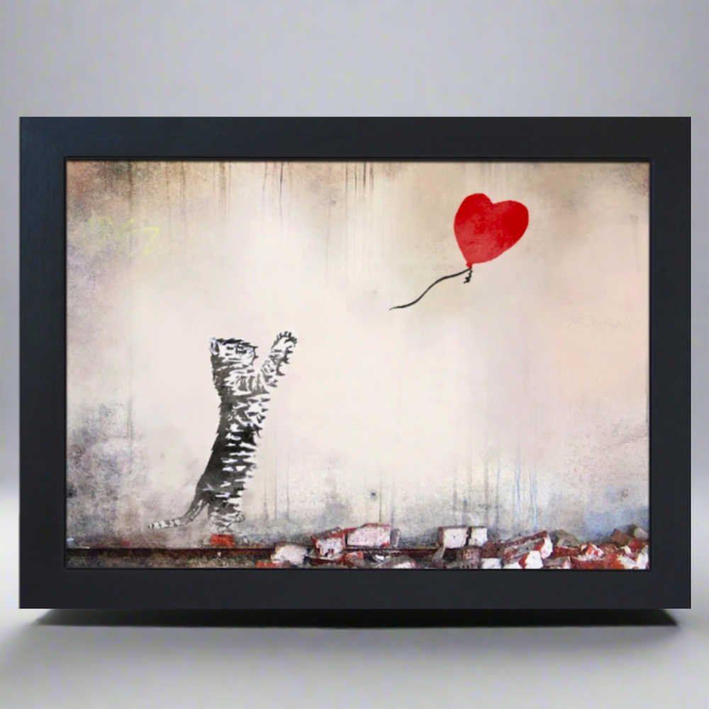 A lap tray with a printed design depicting a silhouette of a cat with a balloon, inspired by Banksy's 'Girl with Balloon' artwork.