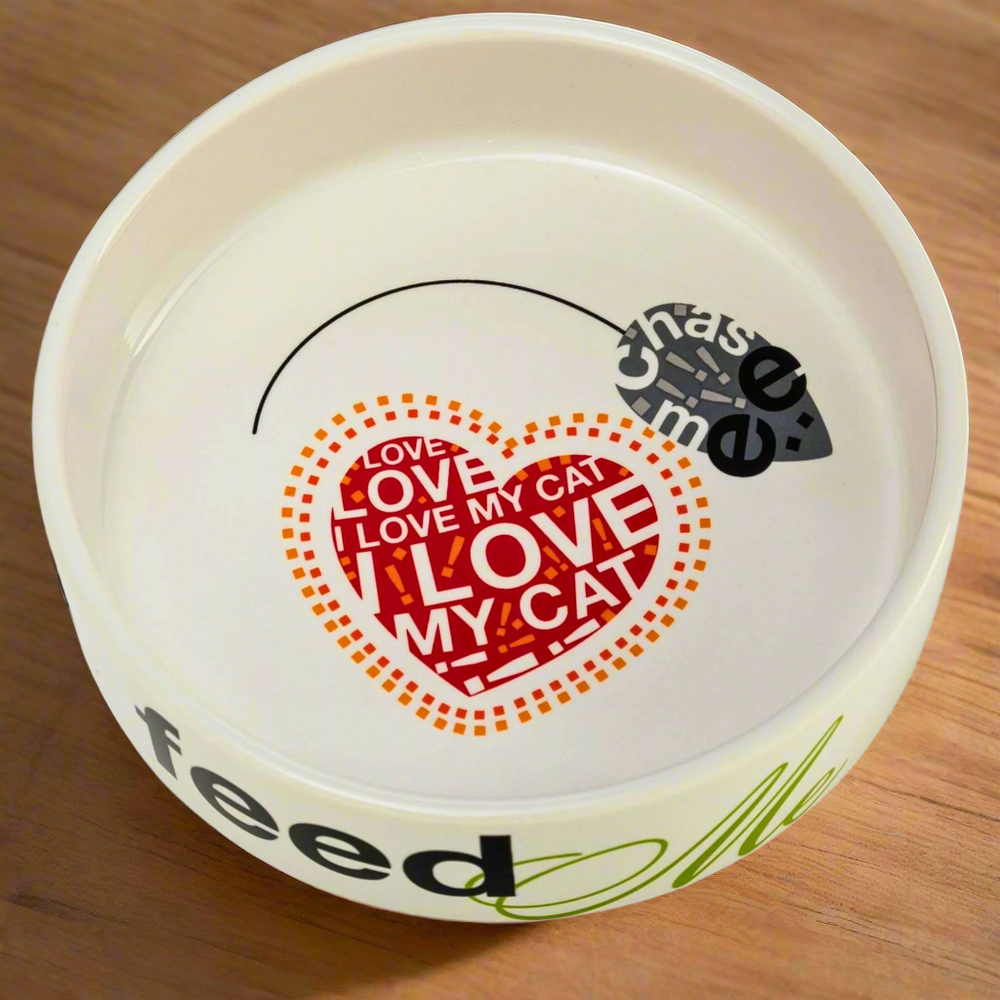 A ceramic cat bowl with a 'I Love My Cat' heart and mouse design.