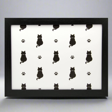 A black cat lap tray with a white background featuring a pattern of black cats and paw prints.