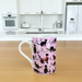 Mug with black cat pattern on a pink background