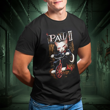 Person wearing a black t-shirt with a graphic design of a cat on a tricycle and text.