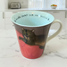 Mug with a cat design on a kitchen counter