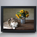 A lap tray with a printed image of a cat lying next to a vase of sunflowers on a wooden table.