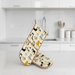 Pair of oven mitts with cat pattern on a kitchen counter