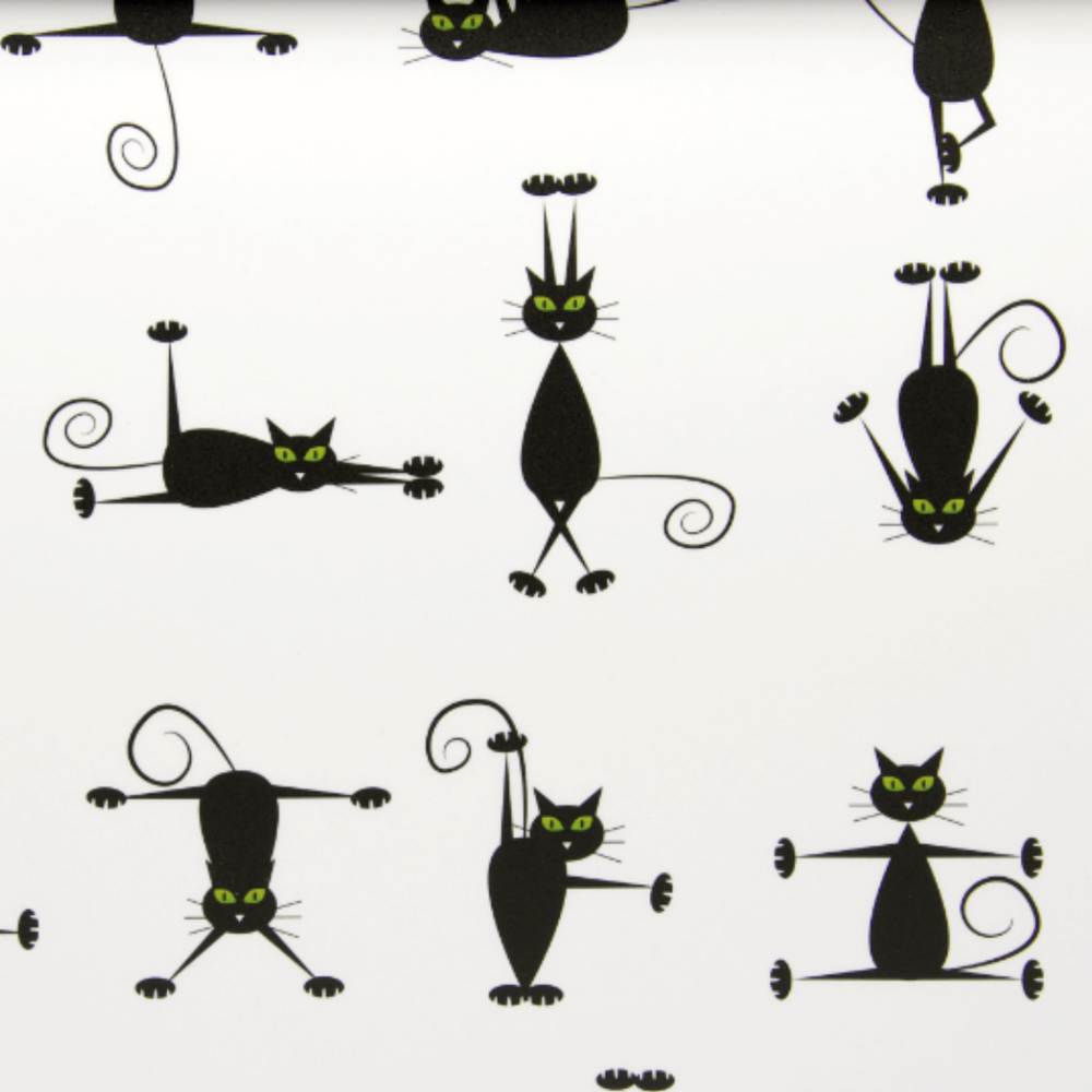 Pattern of black cats with green eyes on a white background