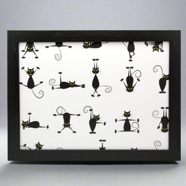 Framed artwork with black cat illustrations on a white background