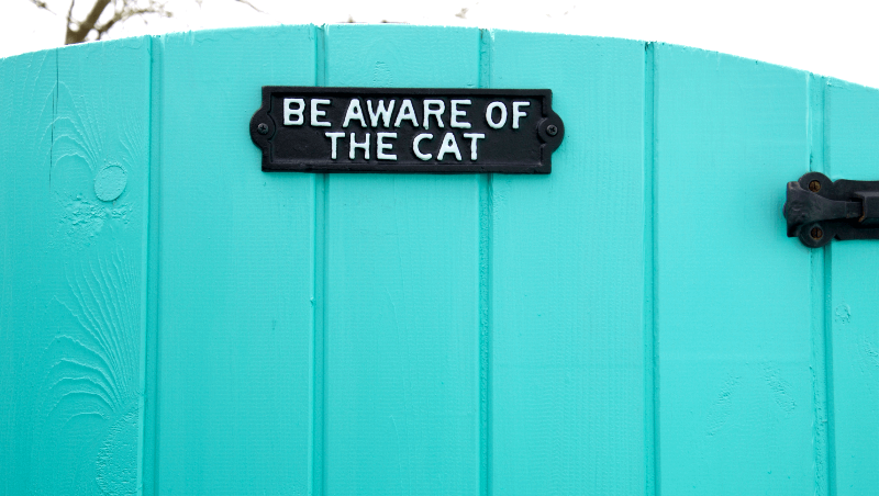 Be Aware of the Cat Cast Iron Plaque